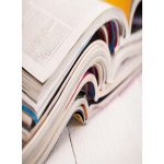 stack of open books placed atop one another