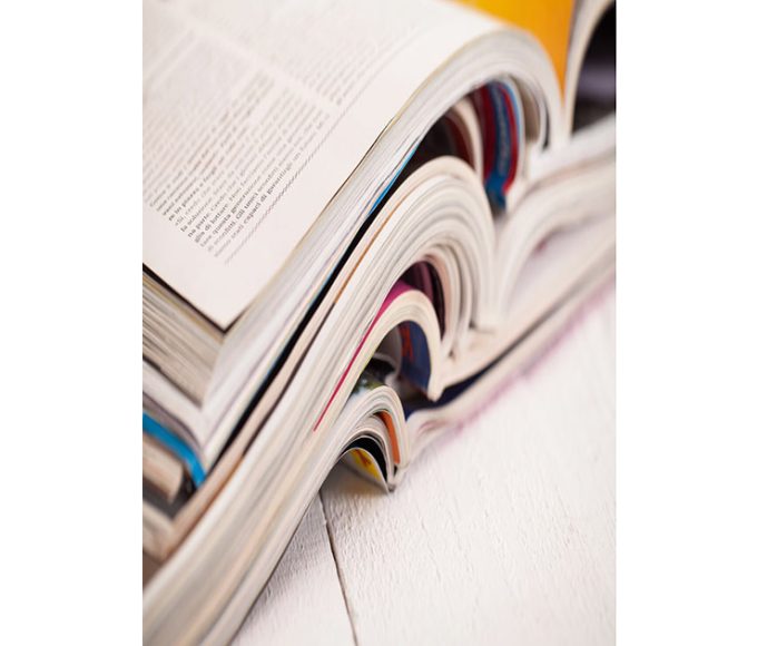 stack of open books placed atop one another