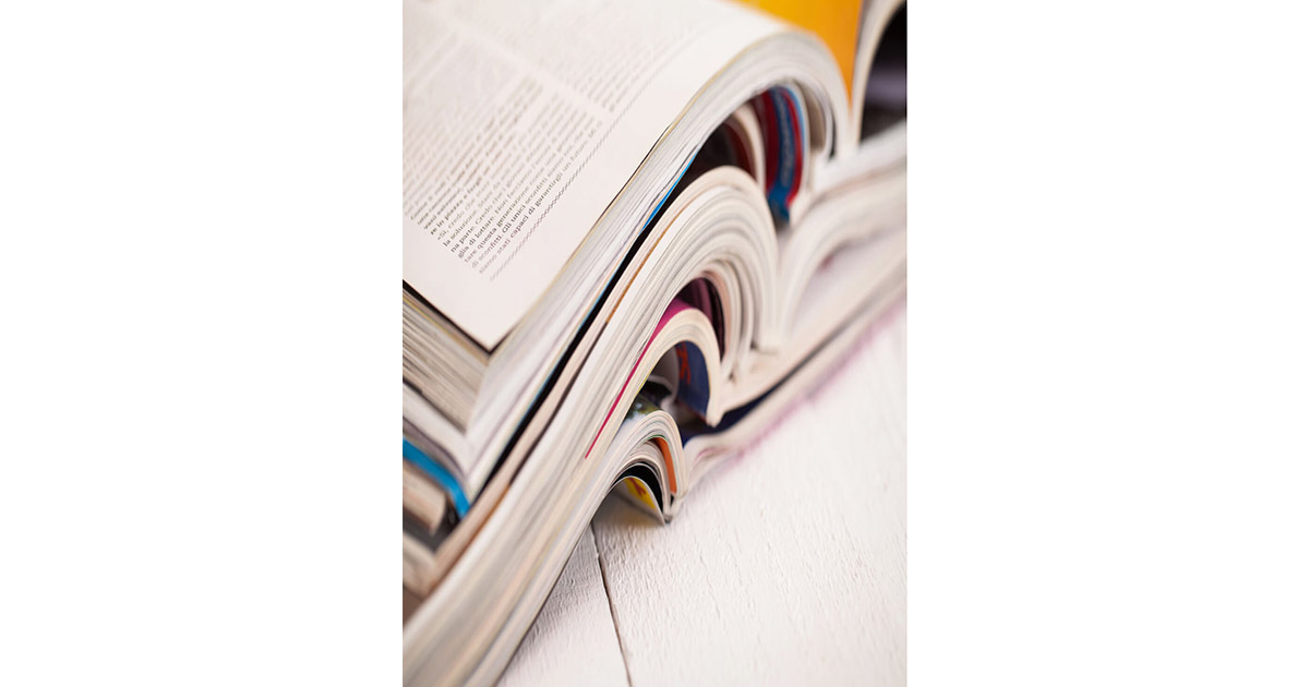 stack of open books placed atop one another